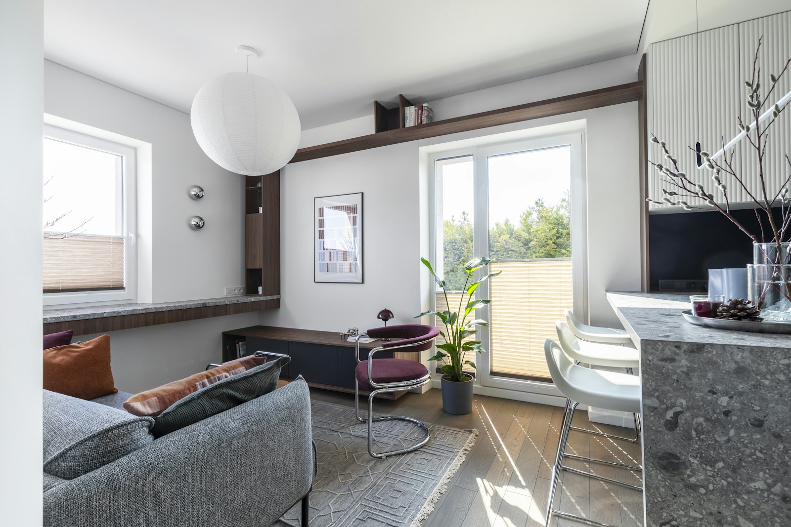 A bright living room with a balcony, shown for illustration